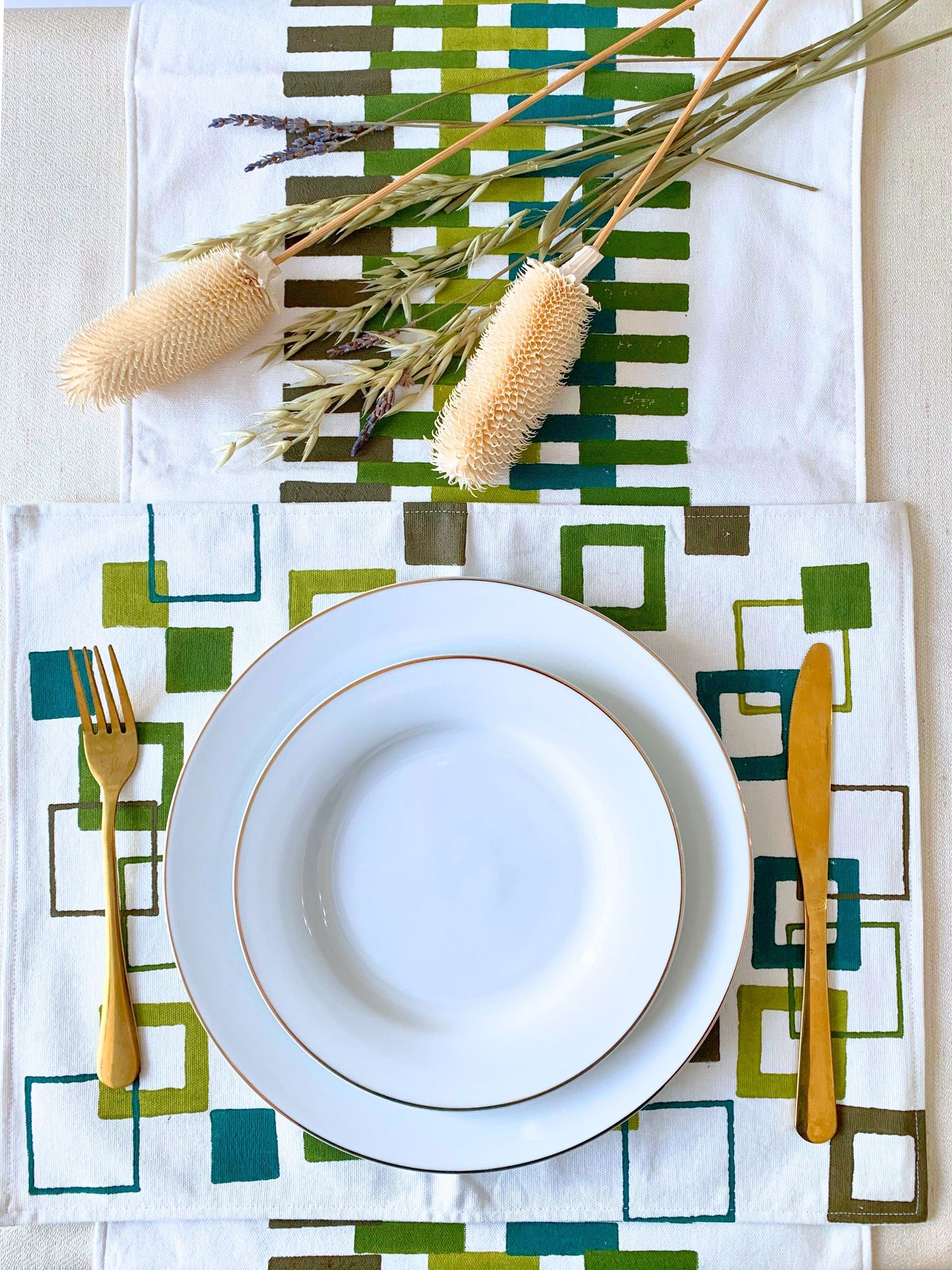 GOTS certified organic cotton table mats with green block printed geometric pattern