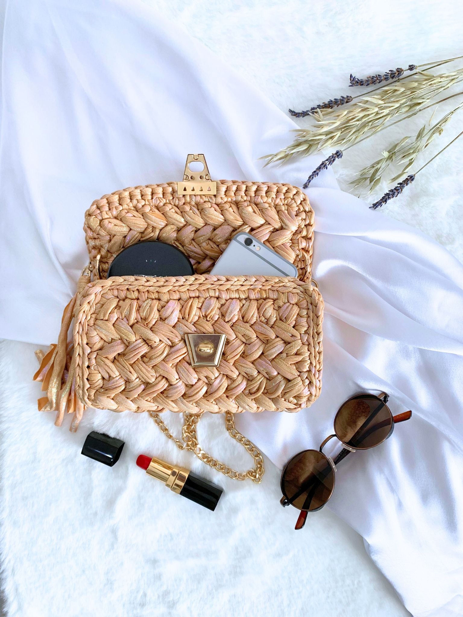 Versatile beige handcrafted crochet bag featuring a subtle yet stylish shimmer.