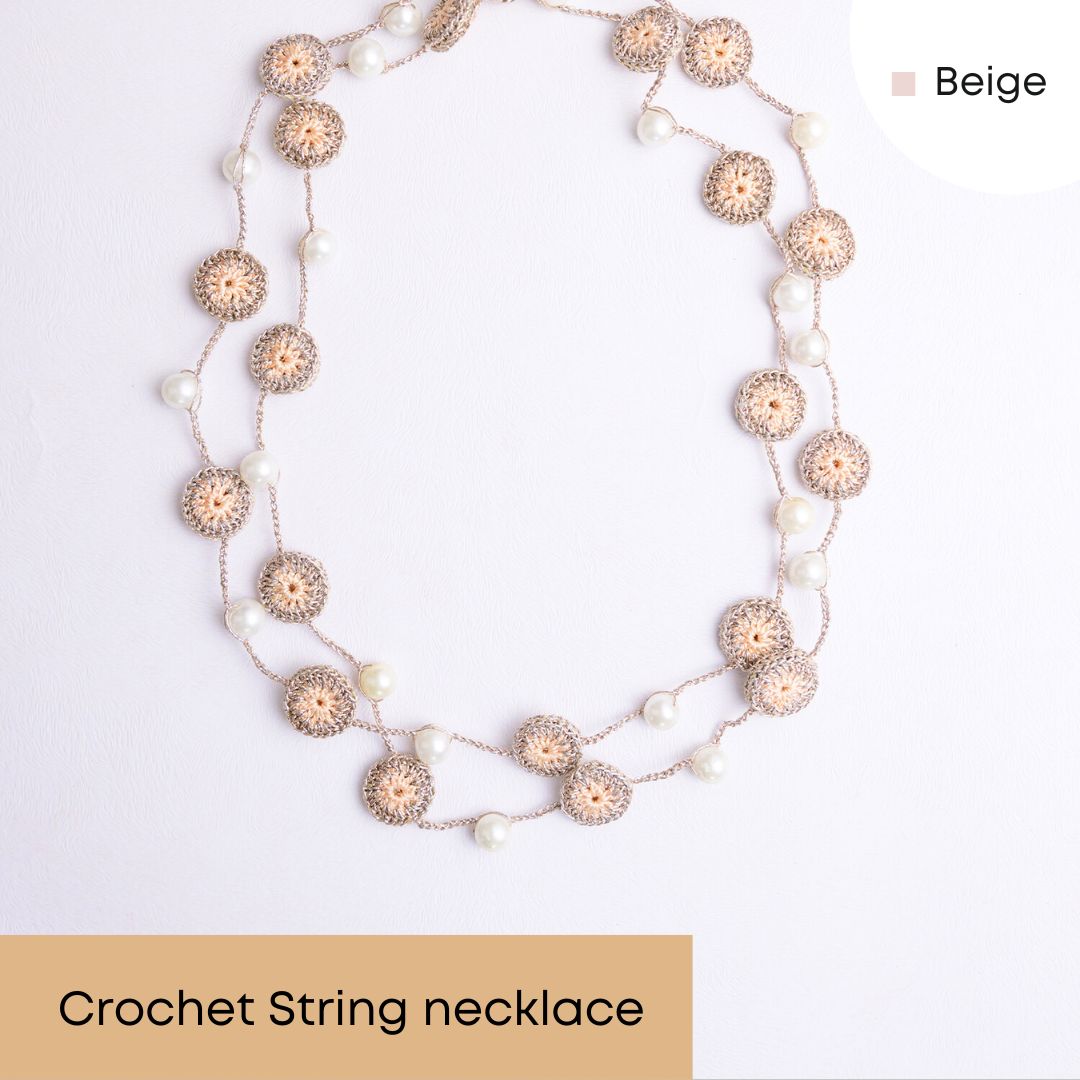 Charming  beige handcrafted necklace combining lightweight design, crochet, and pearls.