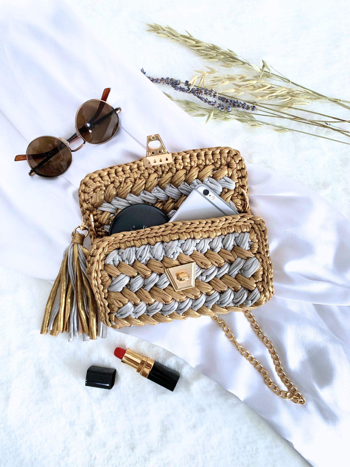 Boldly stylish gold and silver crochet bag, a must-have for any fashion-forward occasion.