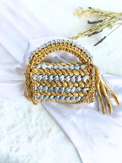 Meticulously crafted crochet handbag with detachable chain in stunning gold and silver.