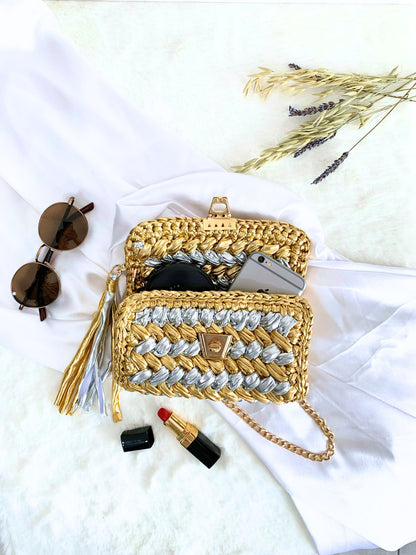 Crochet bag in a dazzling gold and silver duo, ideal for making a bold impression.