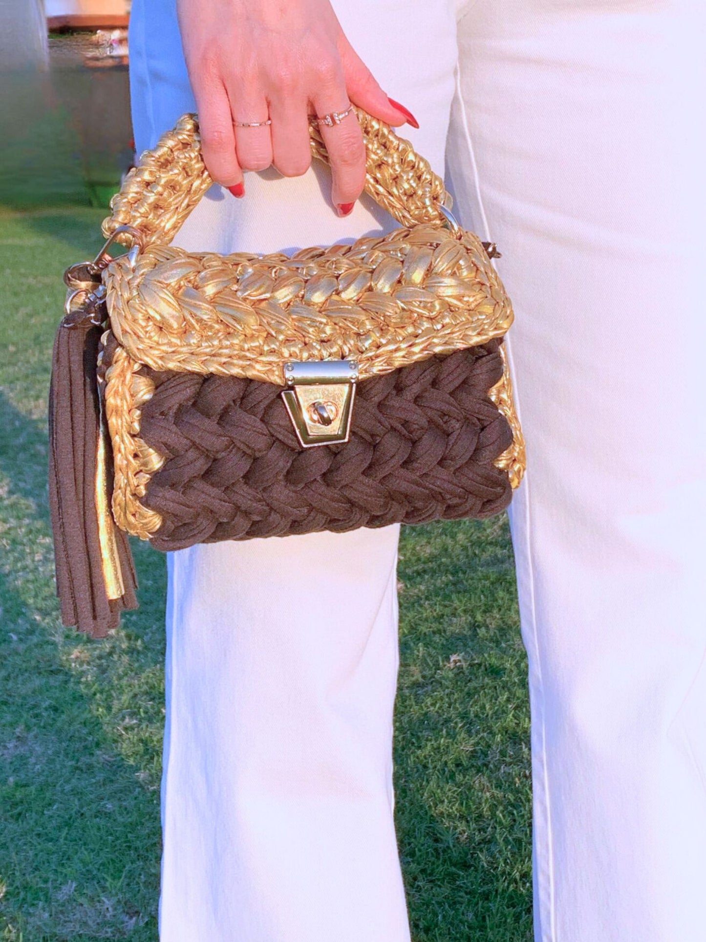 One-of-a-kind Handcrafted crochet handbag for parties in gold and black.