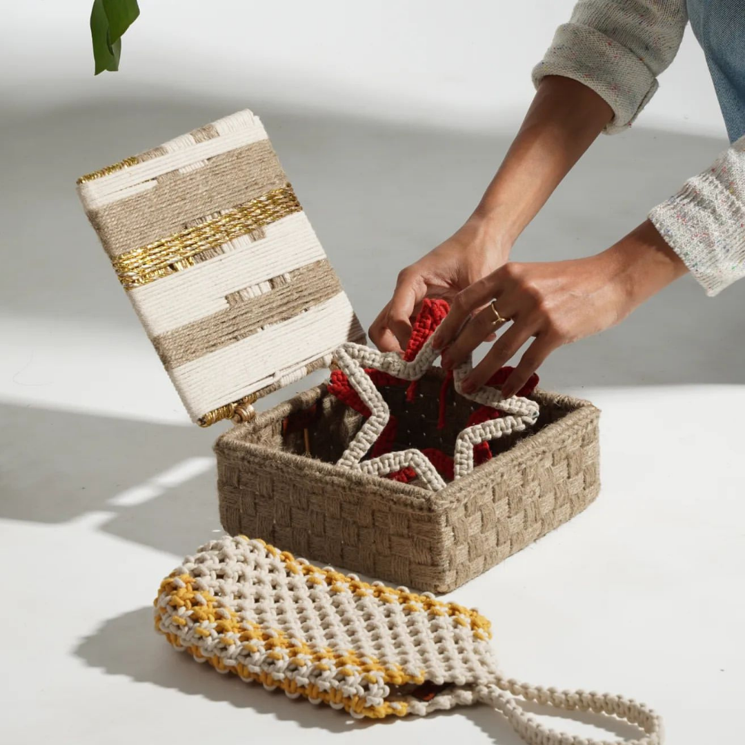 Functional and stylish, this handwoven box with classic accents is crafted using upcycled plastic, jute, and cotton ropes