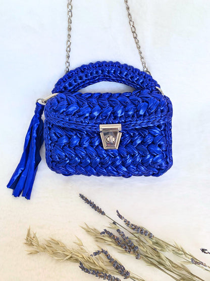 Blue crochet handbag made from eco-friendly metallic yarn.