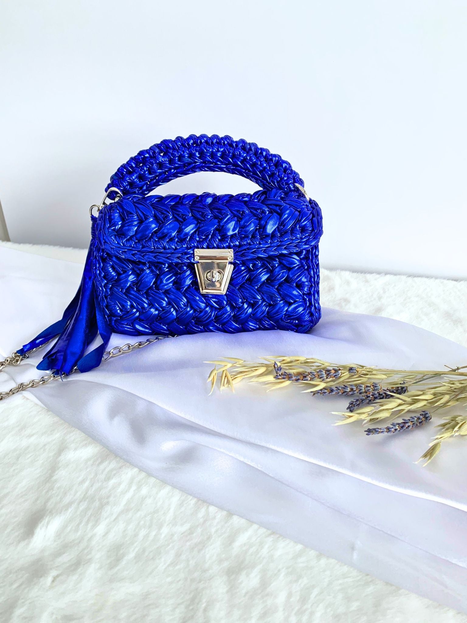 handcrafted crochet party bag in captivating blue, perfect for parties.