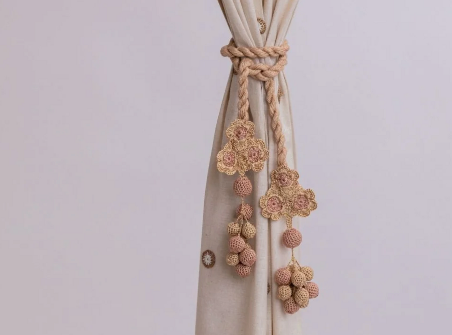 Functional and sophisticated curtain tie backs with subtle crochet details for secure drapery.