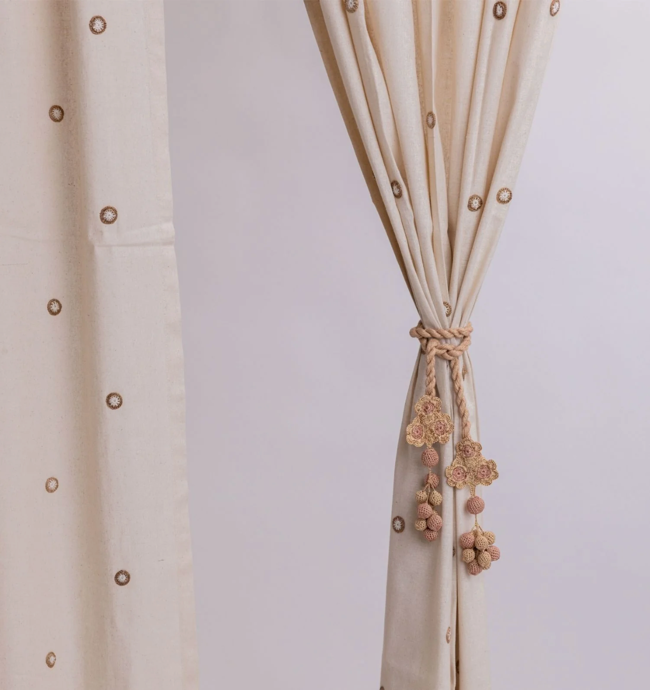 Enhance your curtains with these elegant crocheted tie backs featuring flowers and beads.