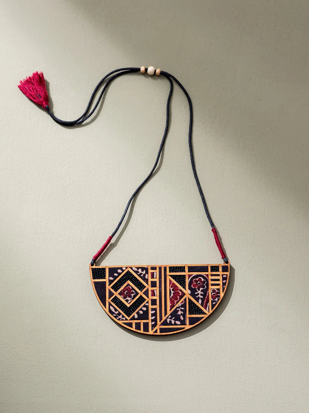 Eco-friendly and trendy neckpiece crafted sustainably, featuring mesmerizing maze pattern.