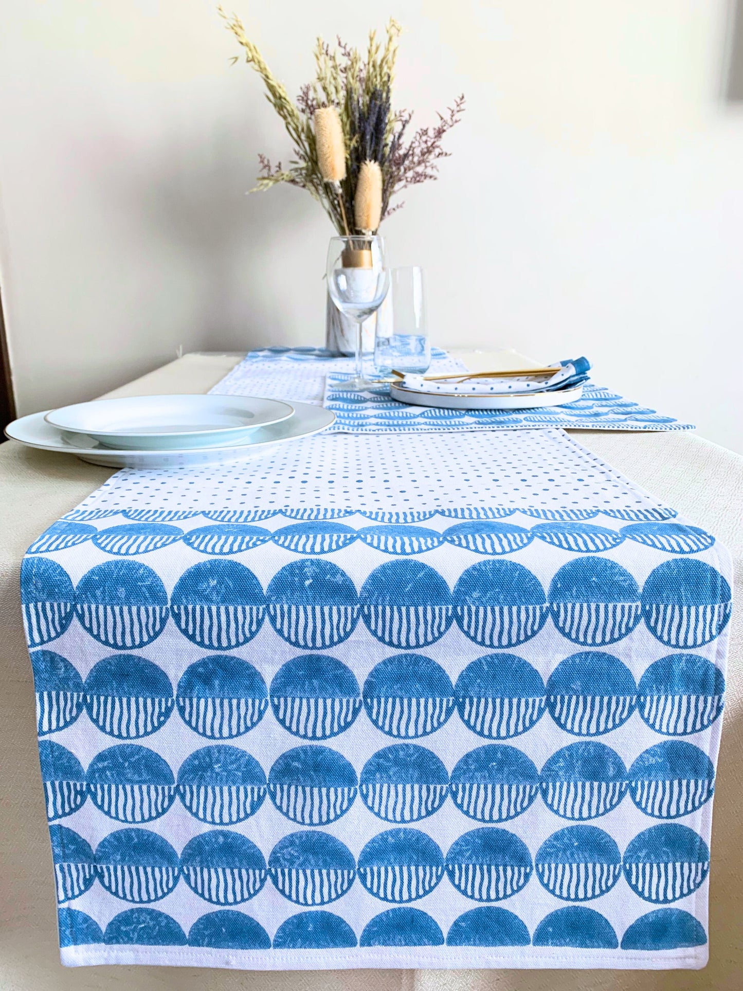 Block printed table runner with a rhythmic circles design.