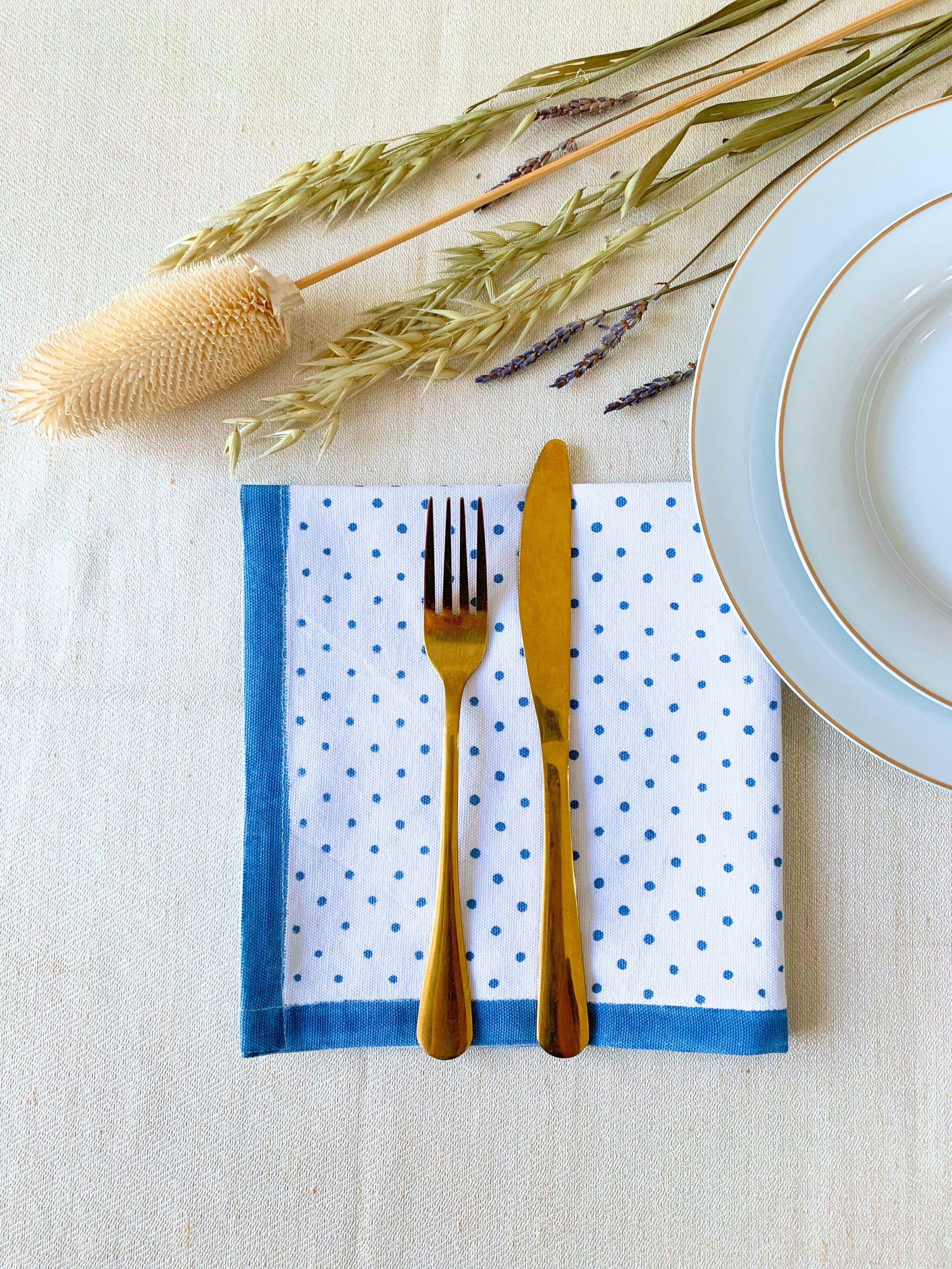 Blue organic cotton table napkins with block print.