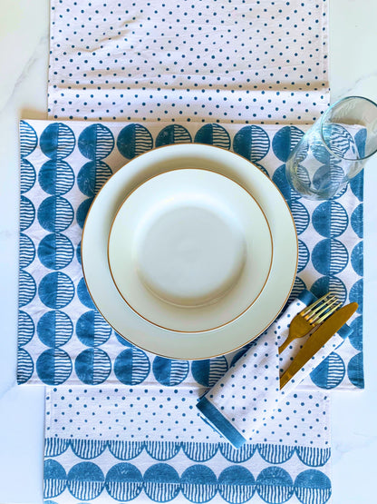 Placemats set on GOTS certified organic cotton with blue circular pattern block printed.