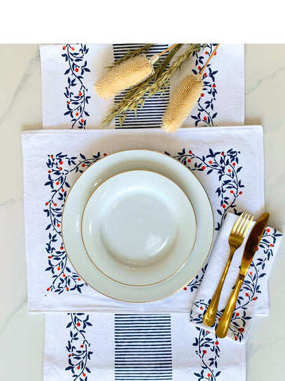 Complete your dining ensemble with this set of 6 block-printed placemats in Blue on GOTS certified organic cotton, showcasing a floral pattern and sketchy lines for a touch of sophistication.