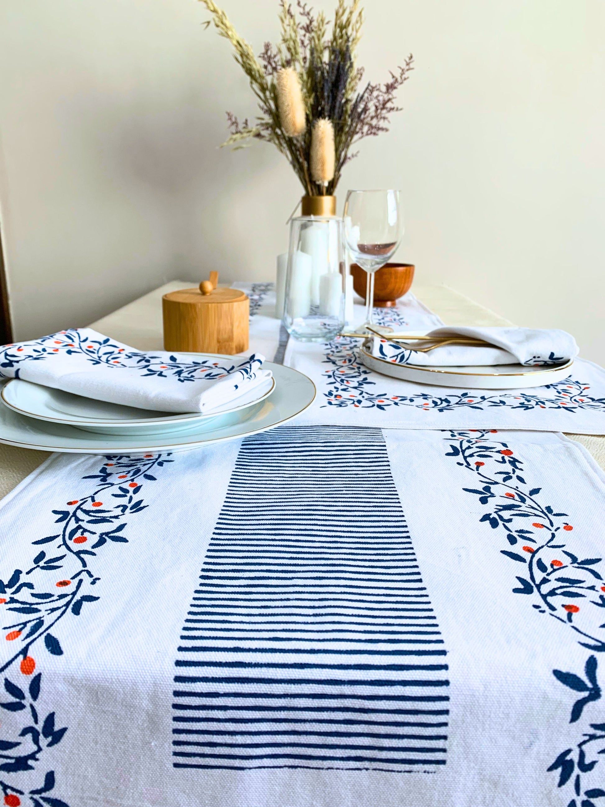 Enhance your dining decor with this table runner adorned in a block-printed floral pattern, crafted from GOTS certified organic cotton for both quality and eco-consciousness. Blue color