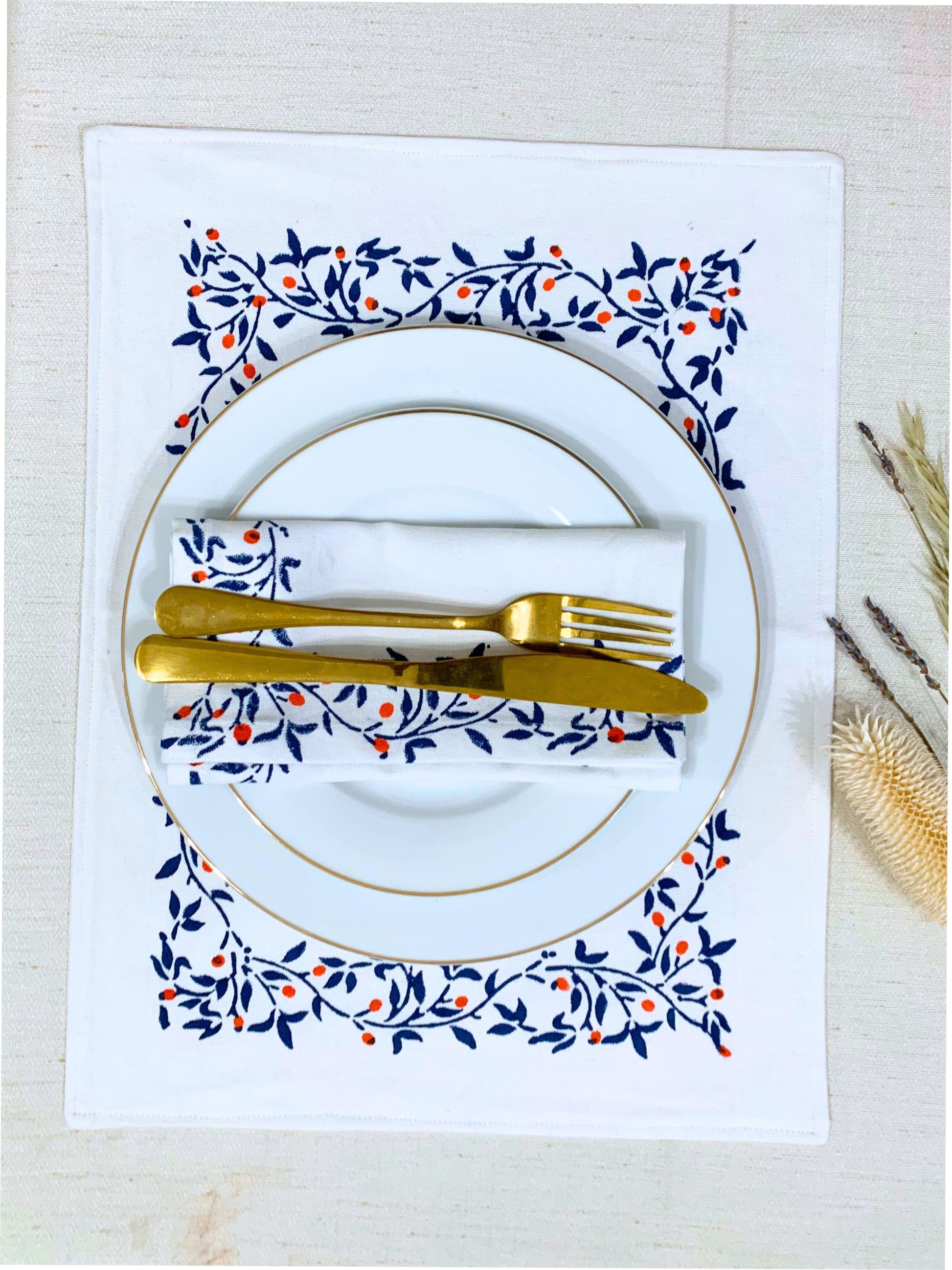 Upgrade your table setting with these double-layered placemats crafted from GOTS certified organic cotton, featuring a seamless block-printed floral pattern. Set of 6 for everyday elegance.