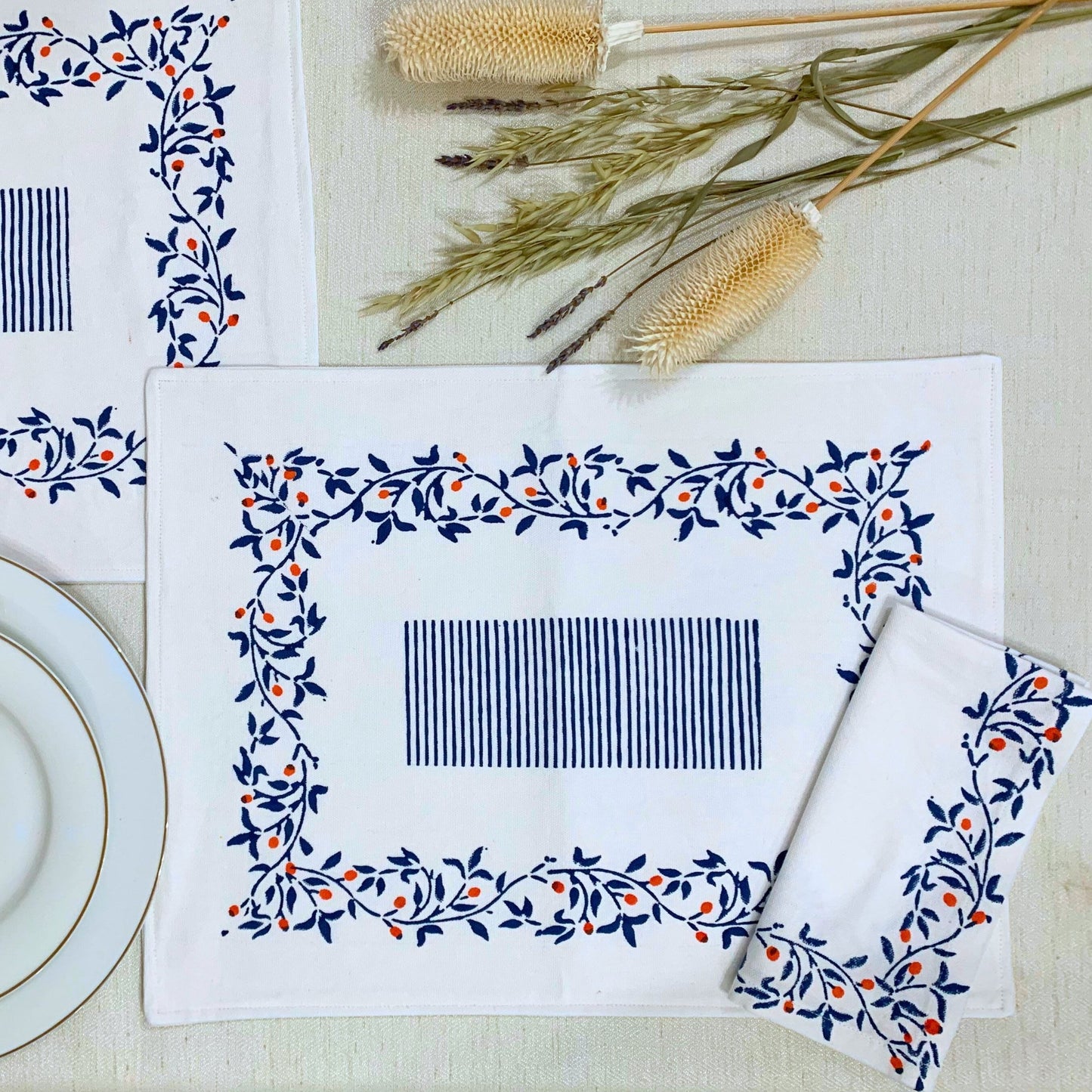 Sustainable dining made chic – set of 6 napkins, block printed on GOTS certified organic cotton, showcasing a blue floral pattern.