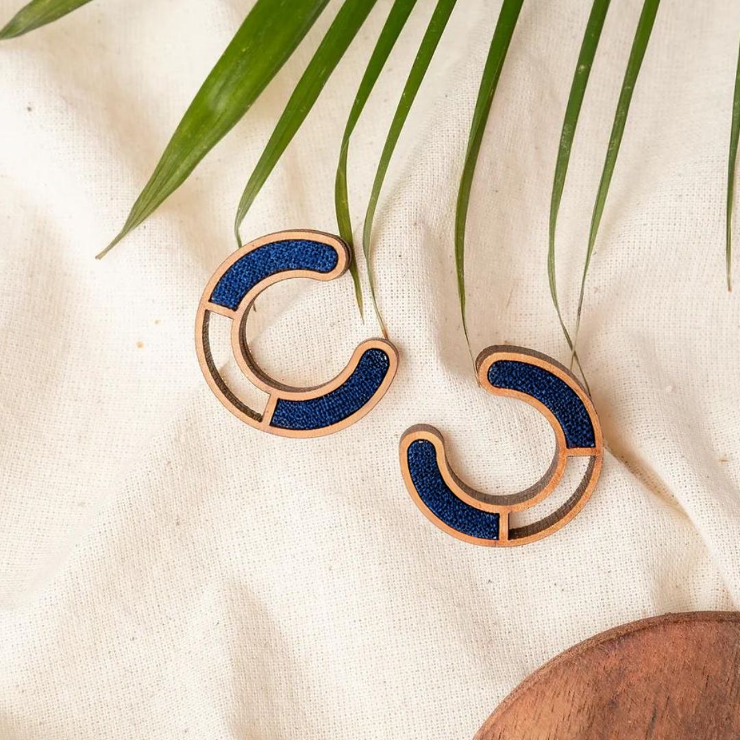 Stylish Compassion earrings with wood and fabric fusion, perfect for modern looks.