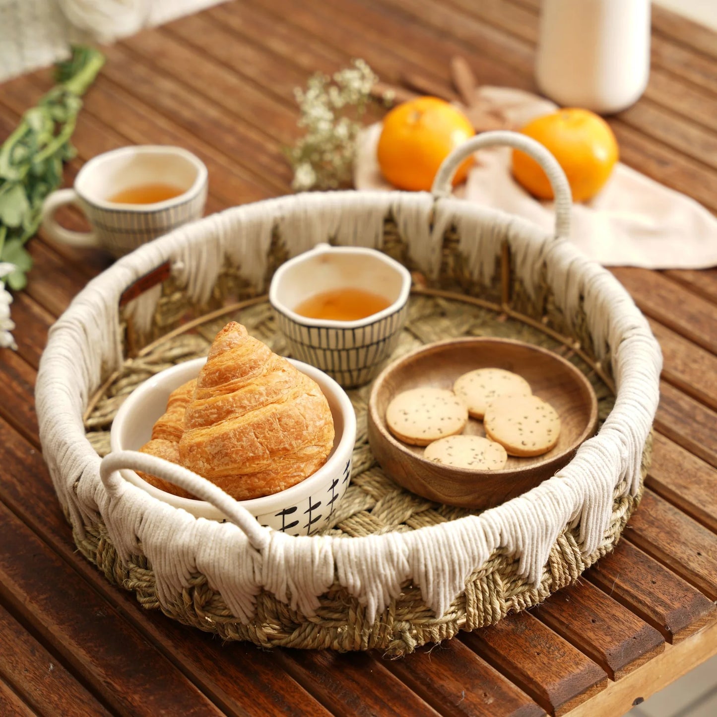 Bohemian-style handwoven tray made from natural grass and cotton ropes, perfect for adding a vibrant touch to your breakfast table.