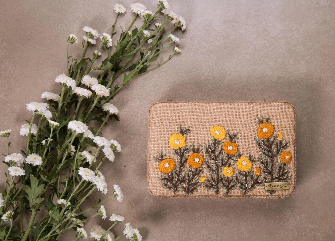 Statement-making hand-embroidered box clutch, perfect for brunch, festivities, and family gatherings.