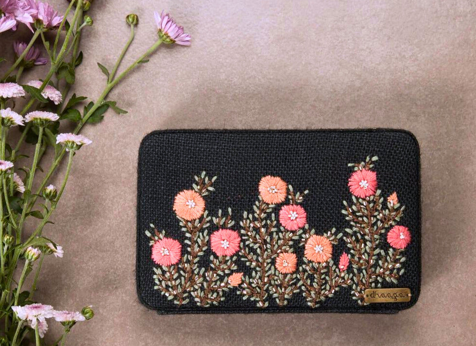 Embroidered box clutch bag in black with pink & peach flowers with attachable chain.