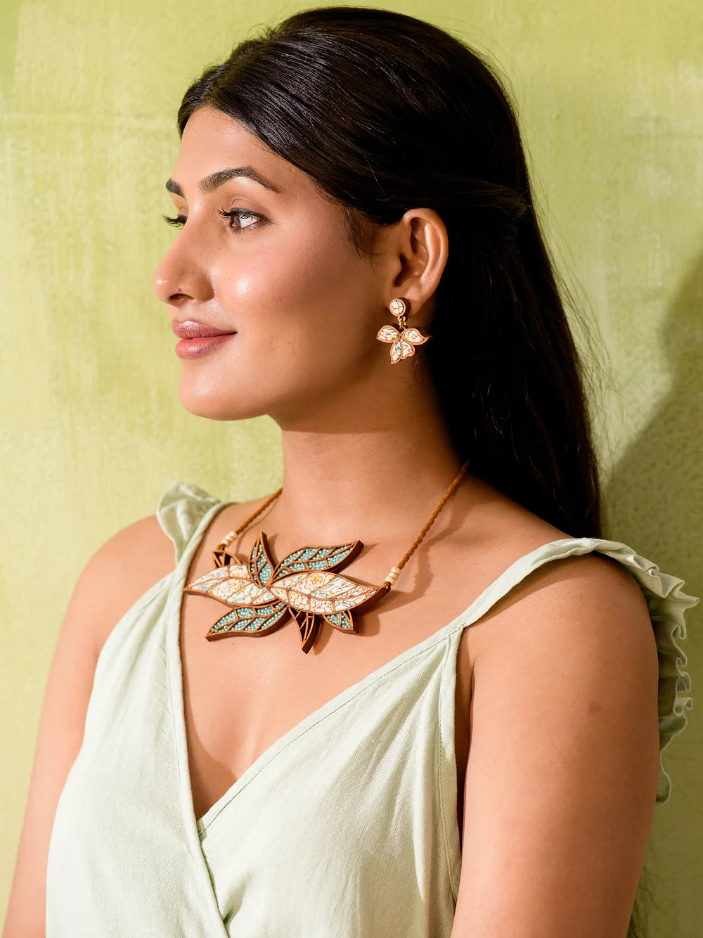 Chic neckpiece with artisanal charm crafted with fabric and glass beads.