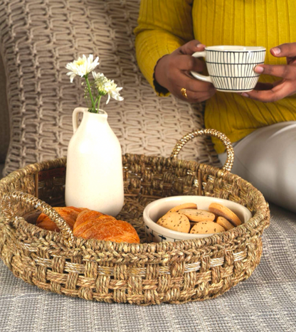 Add a touch of luxury to your breakfast experience with this handwoven tray crafted from natural grass and upcycled plastic.