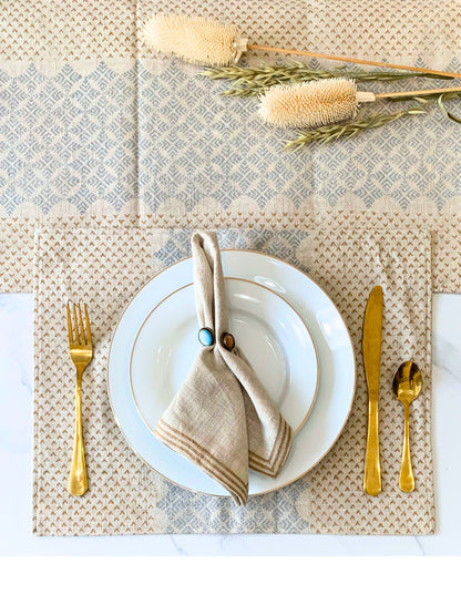 Set of 6 block printed placemats with an elegant geometric pattern in dull gold and silver accents on natural-beige organic cotton fabric.