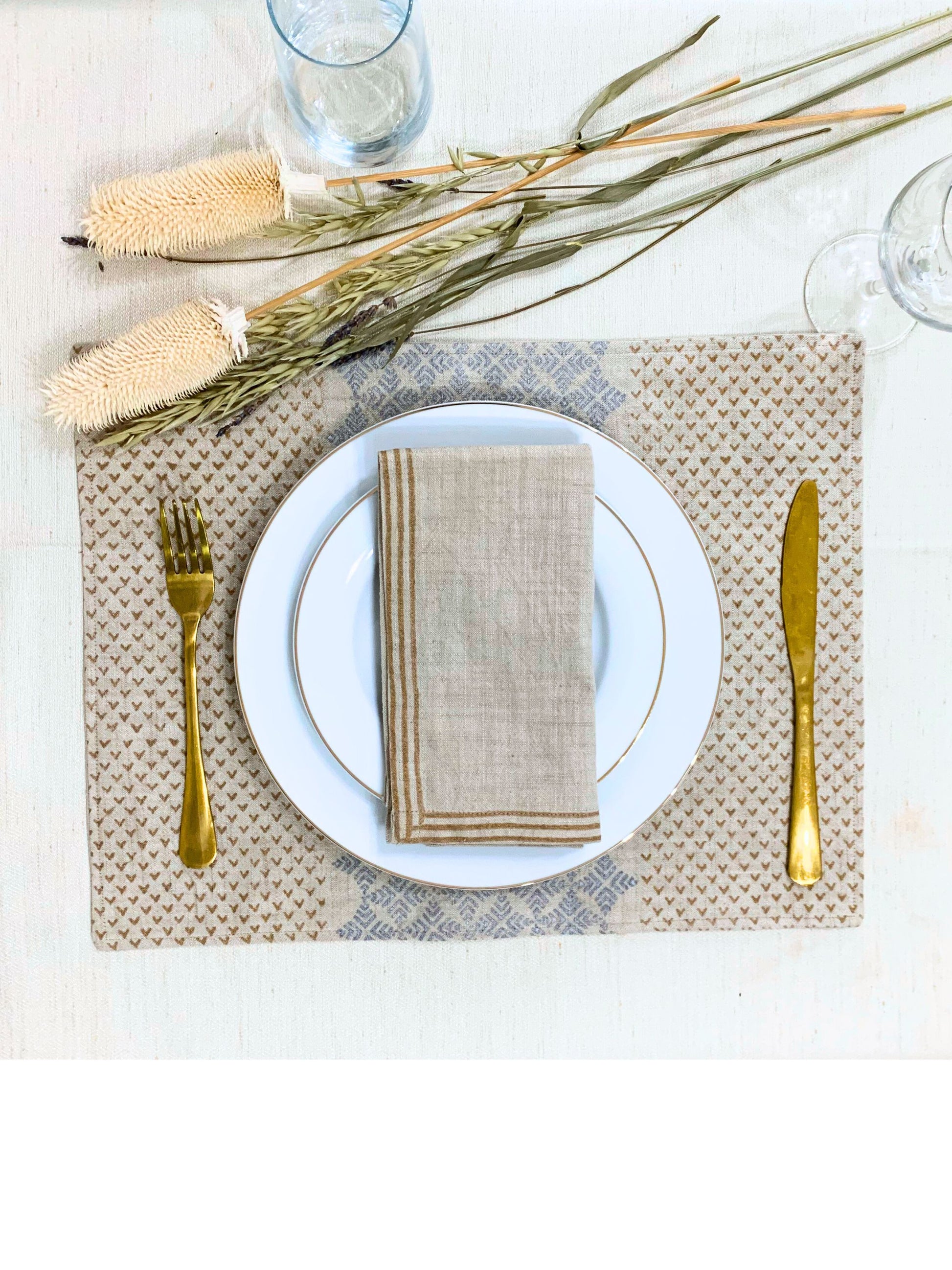 Set of 6 napkins featuring dull gold block printed lines on natural-beige GOTS certified organic cotton fabric, adding an elegant touch to your table setting.