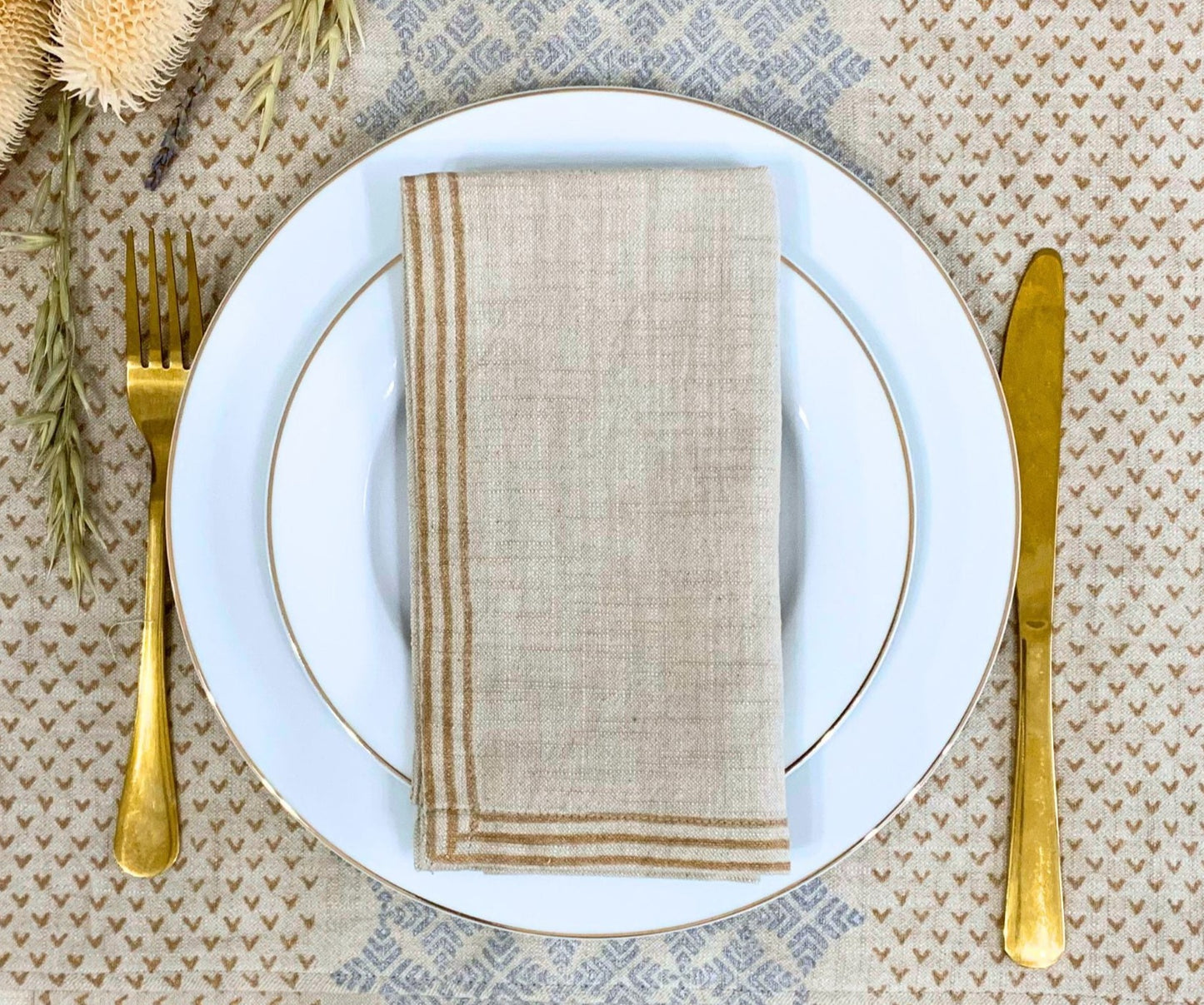 Eco-friendly set of 6 napkins with dull gold block printed lines on GOTS certified organic cotton, providing a touch of elegance for an environmentally conscious lifestyle.