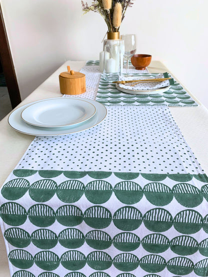 Green table runner on organic cotton with circles pattern and polka dots.