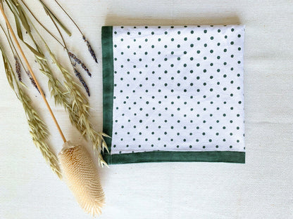 Set of 6 napkins, block printed on GOTS certified organic cotton, showcasing a timeless polka dot pattern in green color for an elegant table setting.