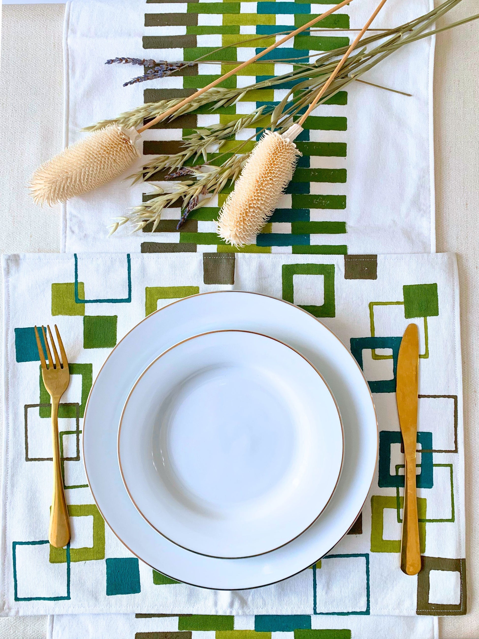 GOTS certified organic cotton table mats with green block printed  geometric pattern 