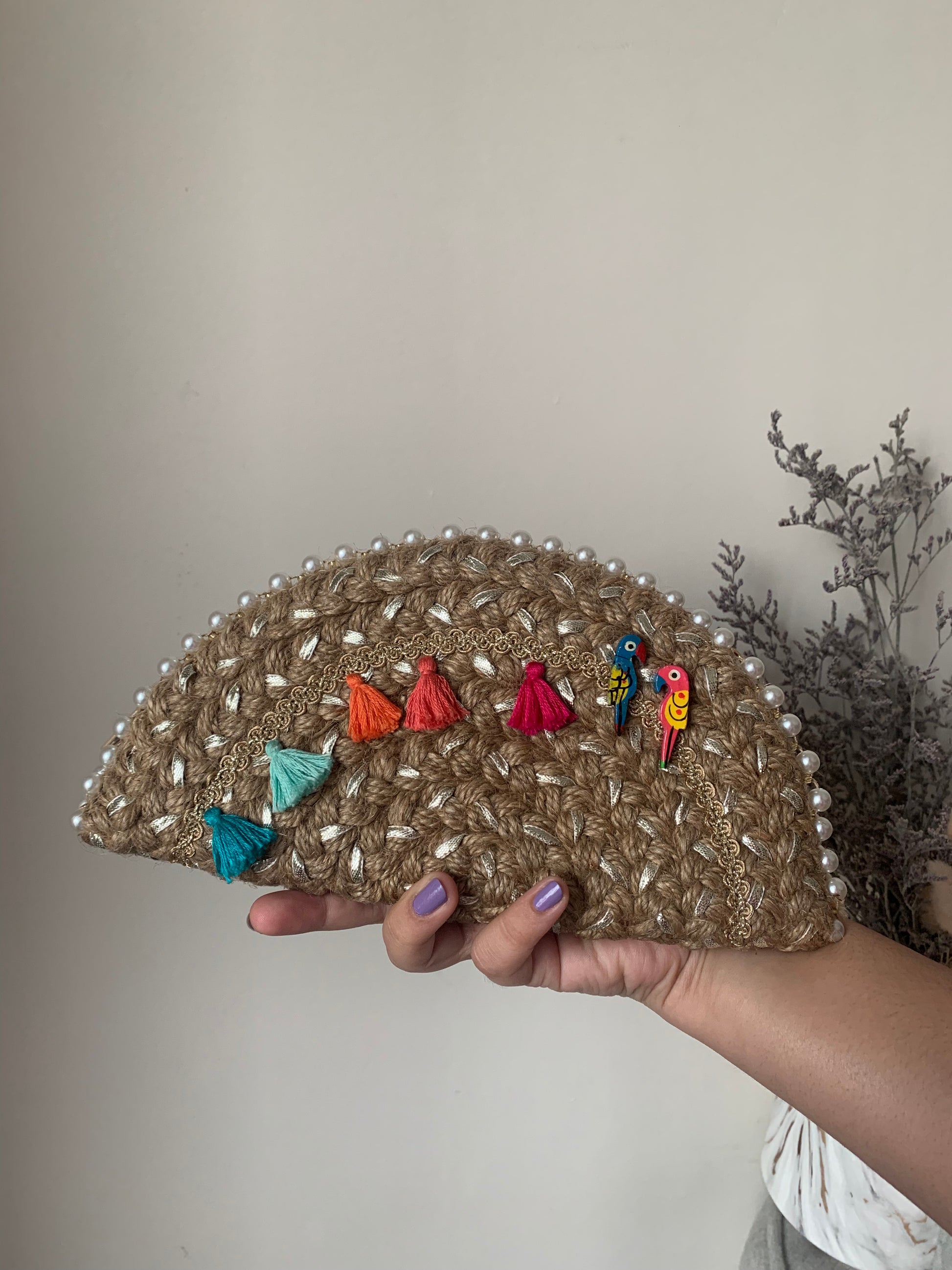 handcrafted clutch bag made from natural fibers making it an environment friendly accessory