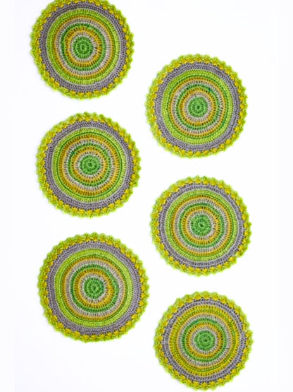 Lime green round crochet coasters, adding a pop of color to your tabletop.