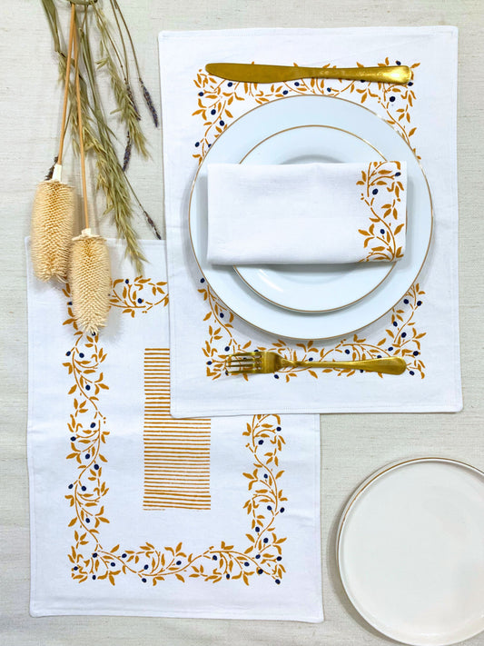 Sustainable dining made stylish – set of 6 double-layered placemats, block printed with a mustard floral pattern and sketchy lines on GOTS certified organic cotton.