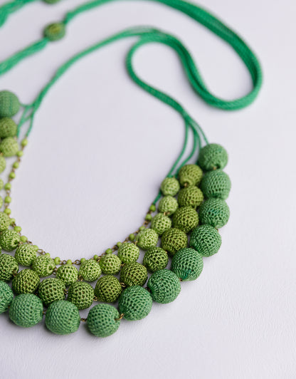 Eye-catching four-layered bead necklace in Green, handcrafted to be your go-to statement piece.