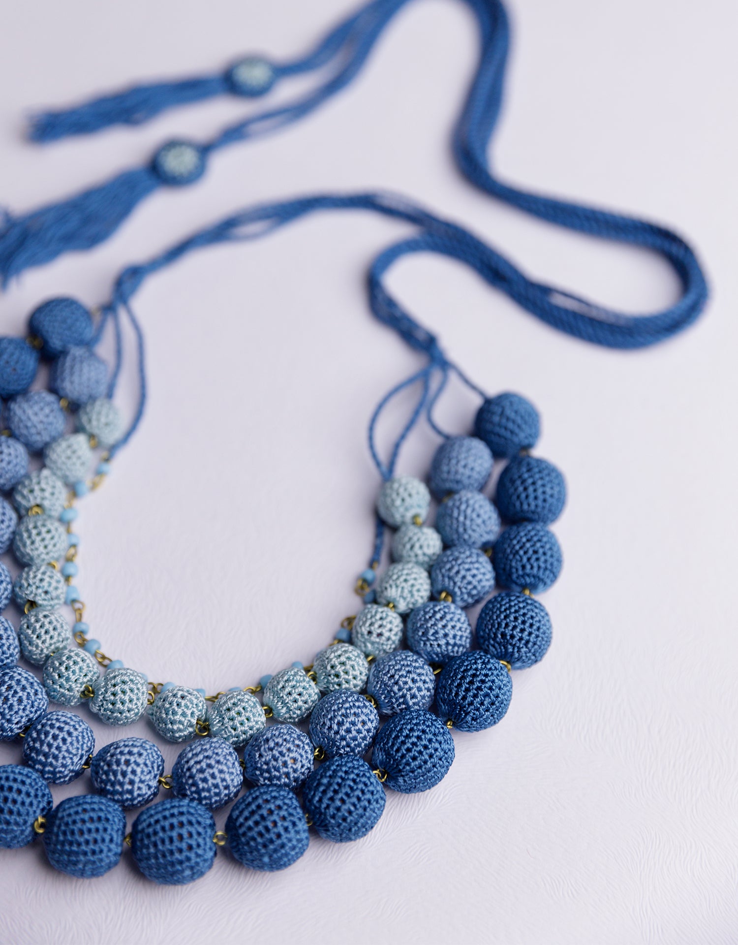 A dynamic touch of color: handmade ombre crochet necklace in blue for casual or special occasions.