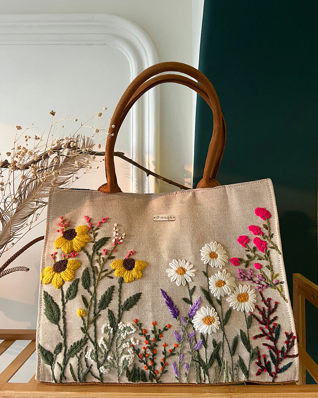 Experience elegance and sustainability with our Handcrafted Garden Tote Bag, featuring a stunning hand-embroidered floral design on natural-colored sustainable fabric.