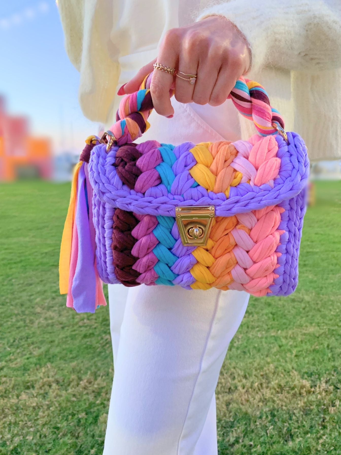 Rainbow colored crochet handbag.