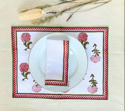 Upgrade your dining experience with this set of 6 napkins, showcasing a vibrant red and green block printed border on GOTS certified organic cotton for both elegance and sustainability.