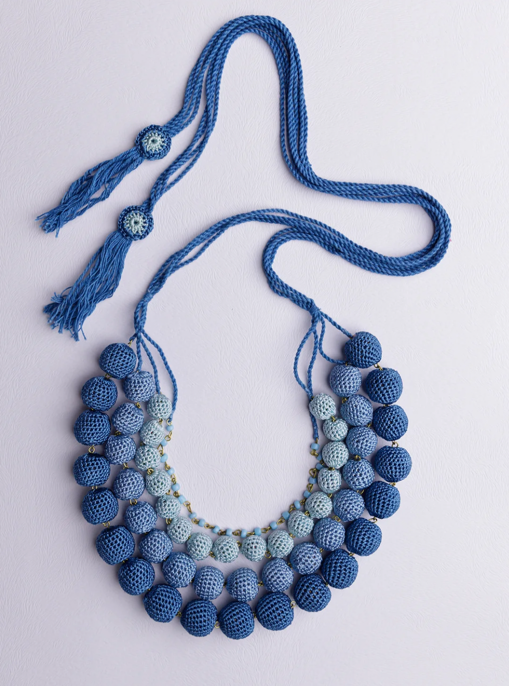 A dynamic touch of color: handmade ombre crochet necklace in blue for casual or special occasions.