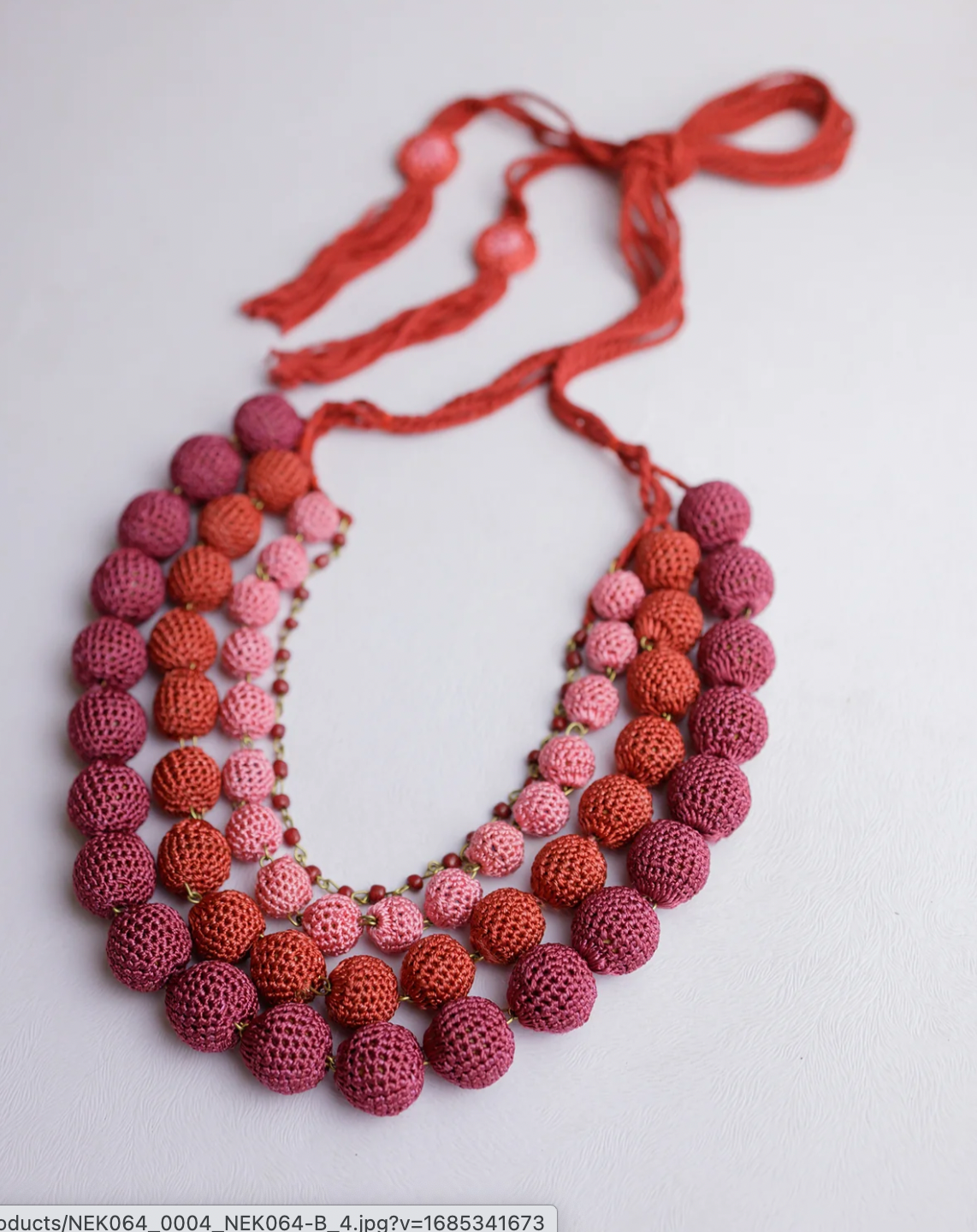 Handcrafted Red ombre four-layered crochet bead necklace for a stunning wardrobe upgrade.