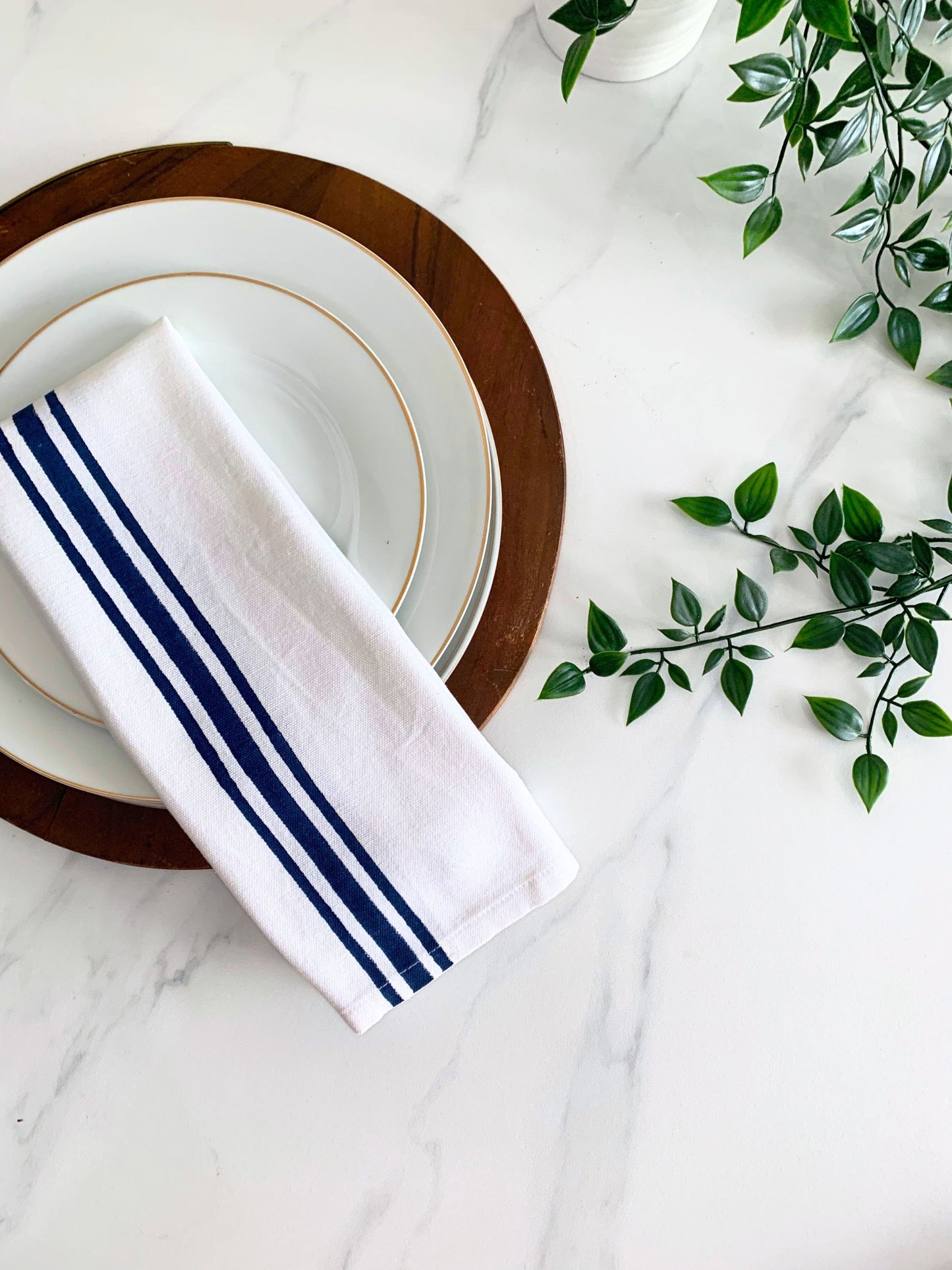 Upgrade your kitchen with these tea towels featuring maroon and blue block printed line borders on GOTS certified organic cotton, a stylish and eco-friendly choice.