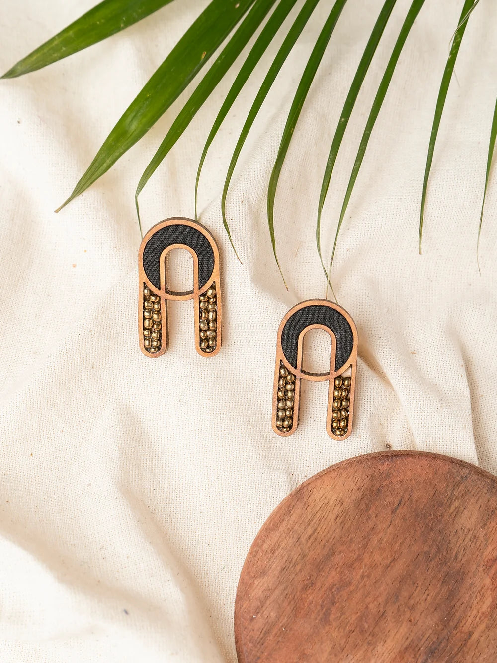 Geometric shape earrings with wood, fabric, and glass beads