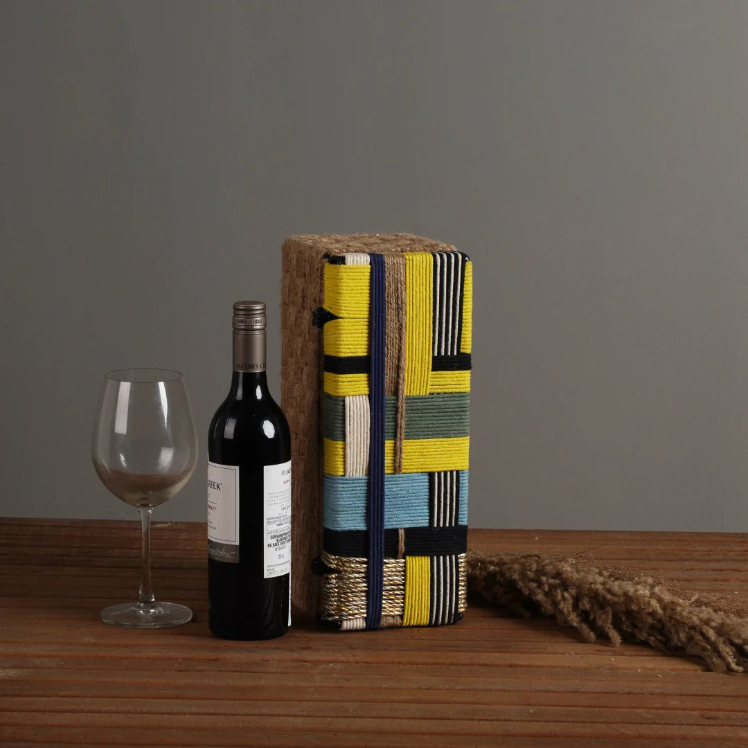 Elegant wine gift box crafted from natural jute fibers and cotton ropes, featuring a sturdy metal frame to support the weight of the bottle.