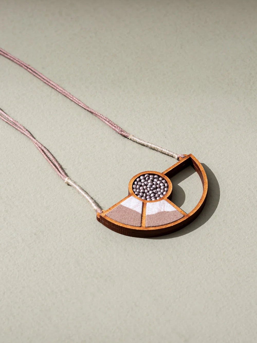 Geometric wood and fabric contemporary jewellery