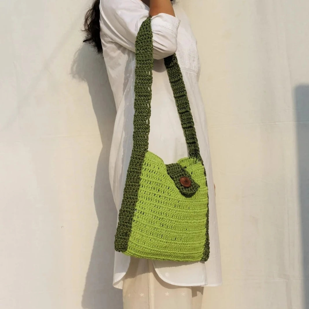 Explore chic style with our hobo bag, intricately crocheted from premium acrylic yarn. The addition of a stylish wooden button closure elevates its design