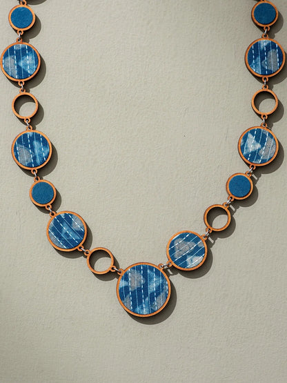 Eco-friendly necklace with double-sided feature, showcasing blue and brown tones.