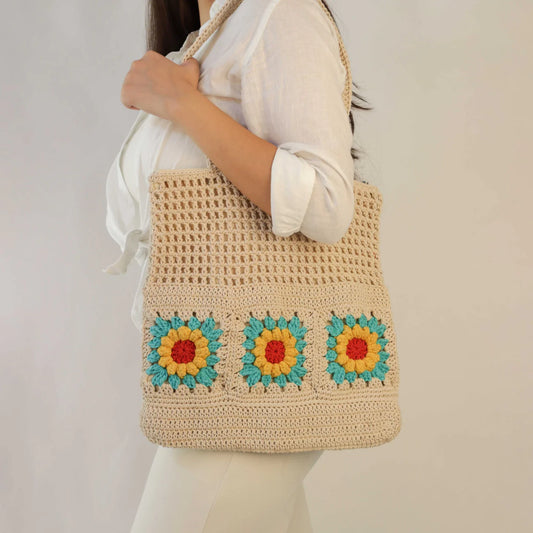 Elevate your style with our hand-crocheted tote bag, a perfect blend of fashion and practicality