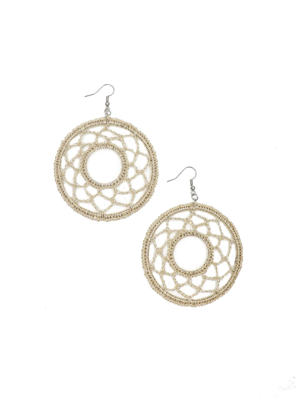 Trendy golden crochet earring with intricate pattern, adding a unique touch to ensembles.